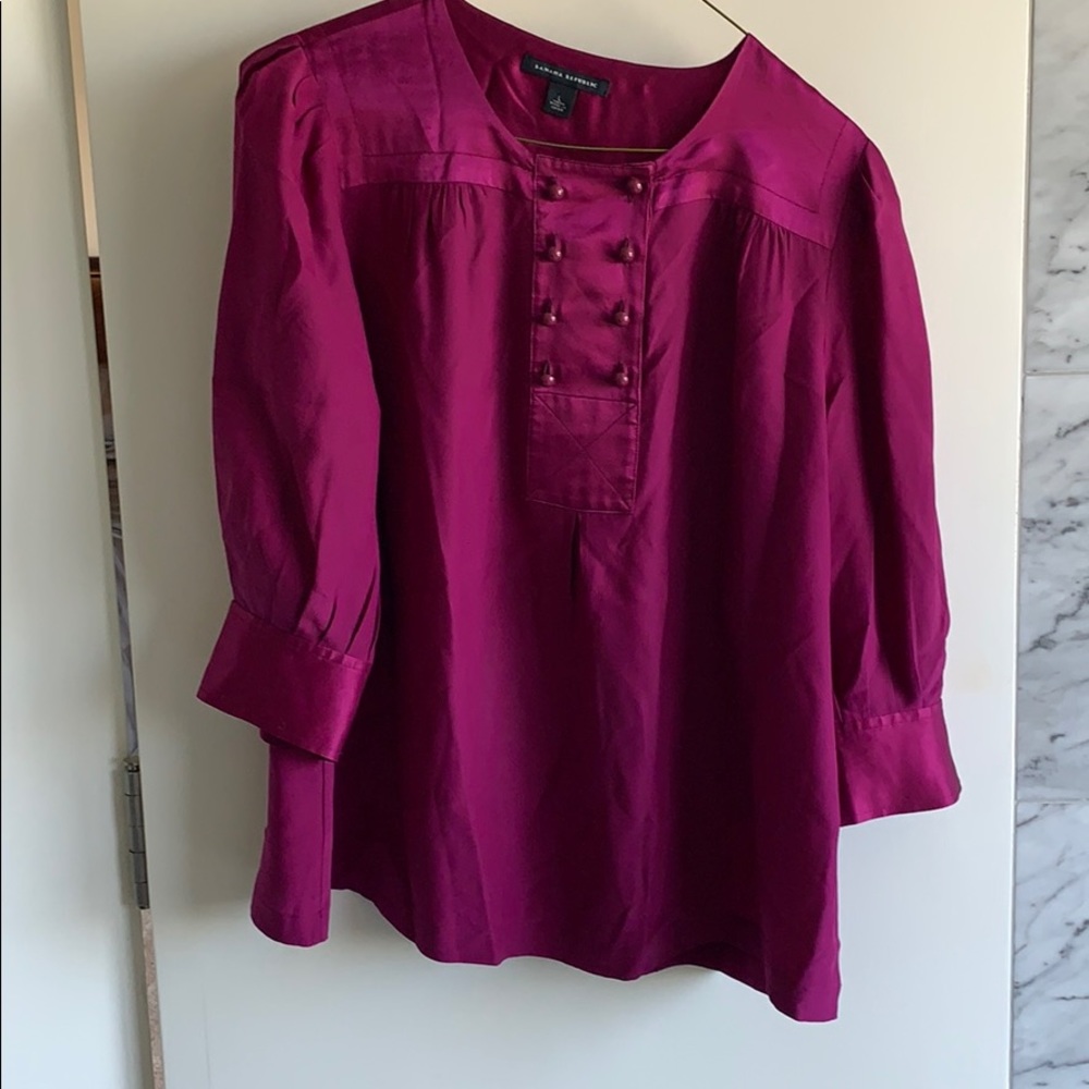 Magenta silky blouse.